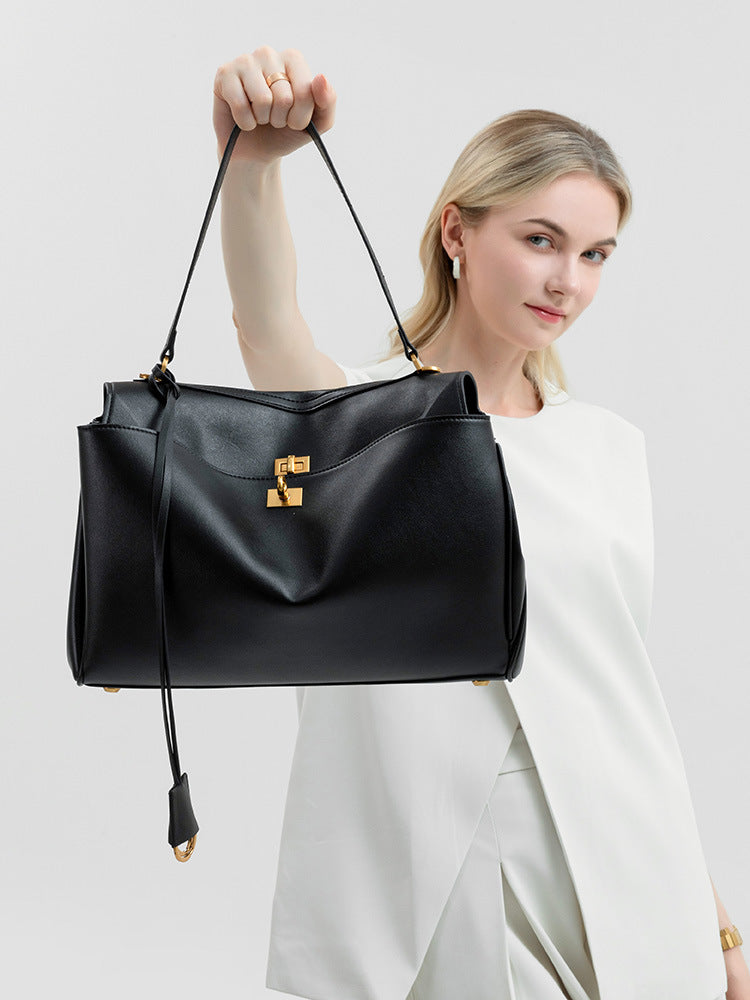 Elegant Black Leather Handbag with Gold Accents - Versatile Shoulder and Hand Carry